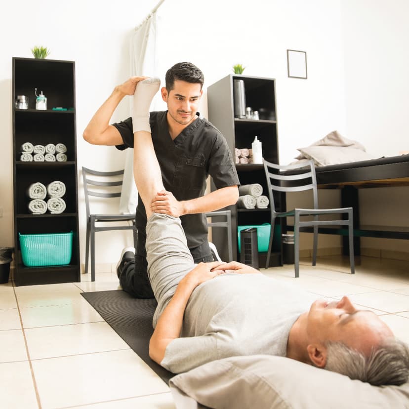 Patient exercising at home with physiotherapist