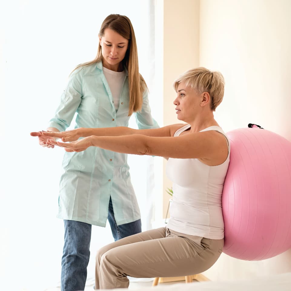 Physiotherapist treating patient at home